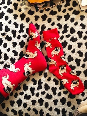 a photo of customers feet in pug socks