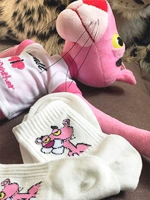 white pink panther socks with pink panther in background